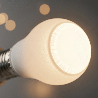 Close-up of a modern LED light bulb emitting warm light, clean image, no text, no words, no typography