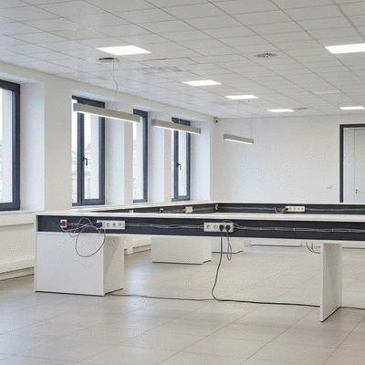 Modern office space with visible electrical outlets and wiring, representing tailored electrical solutions for businesses in Avignon